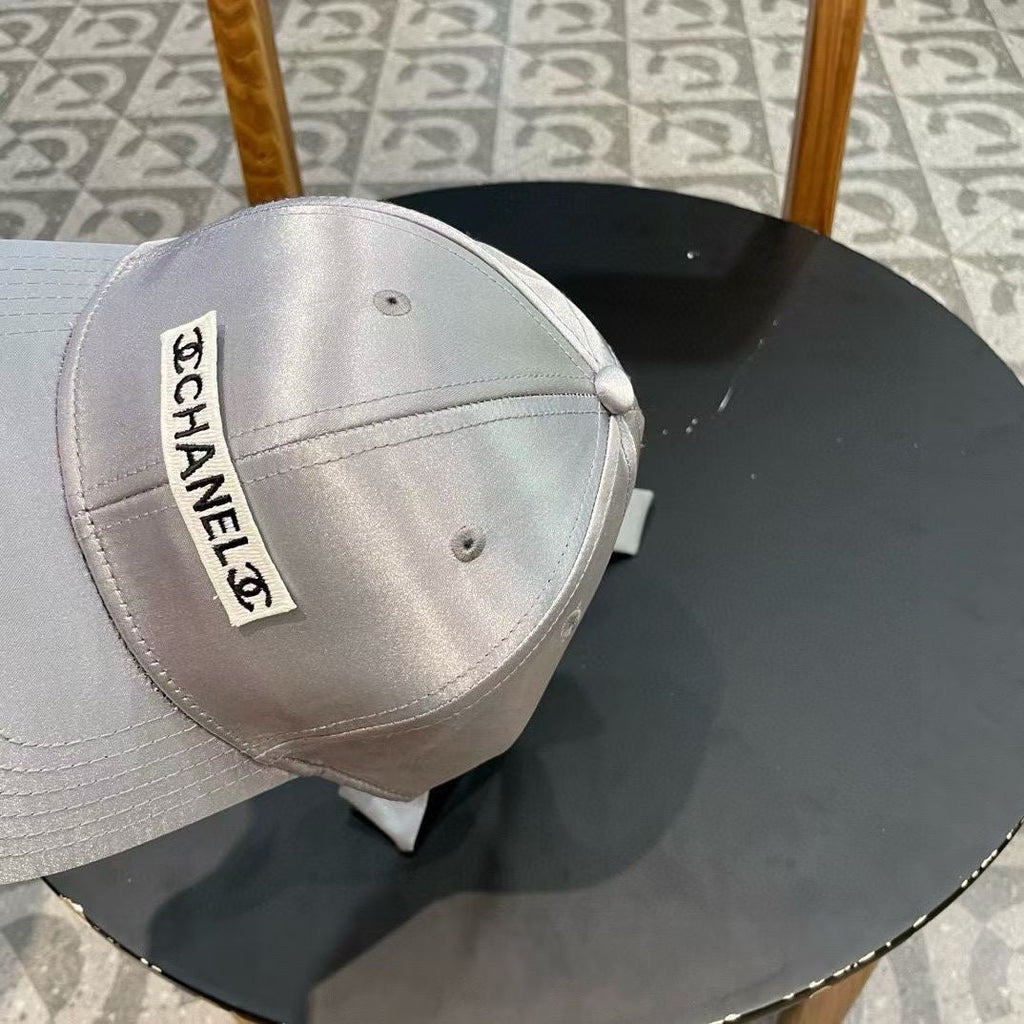 CHANEL BASEBALL HAT IN SILVER SILK SATIN 404865