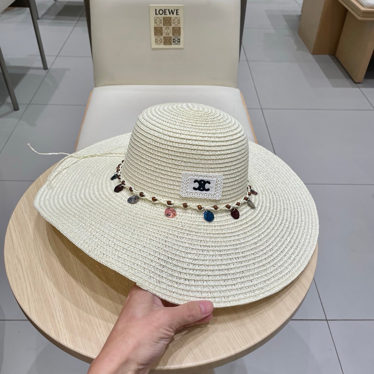CELINE WIDE BRIM HAT MODEL 652186 IN WHITE WOVEN STRAW