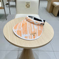 CELINE VISOR HAT MODEL 652202 IN ORANGE AND WHITE FABRIC
